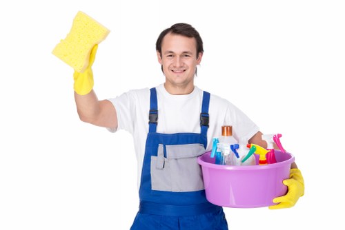 Professional oven cleaner in Richmond removing baked-on grease