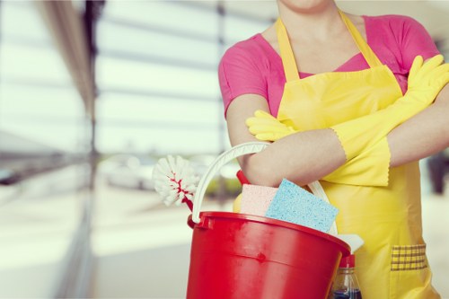 Employee checking and handling cleaning chemicals safely