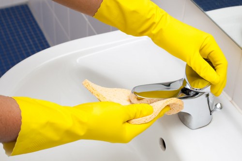 Cleaner using protective equipment while operating cleaning machinery